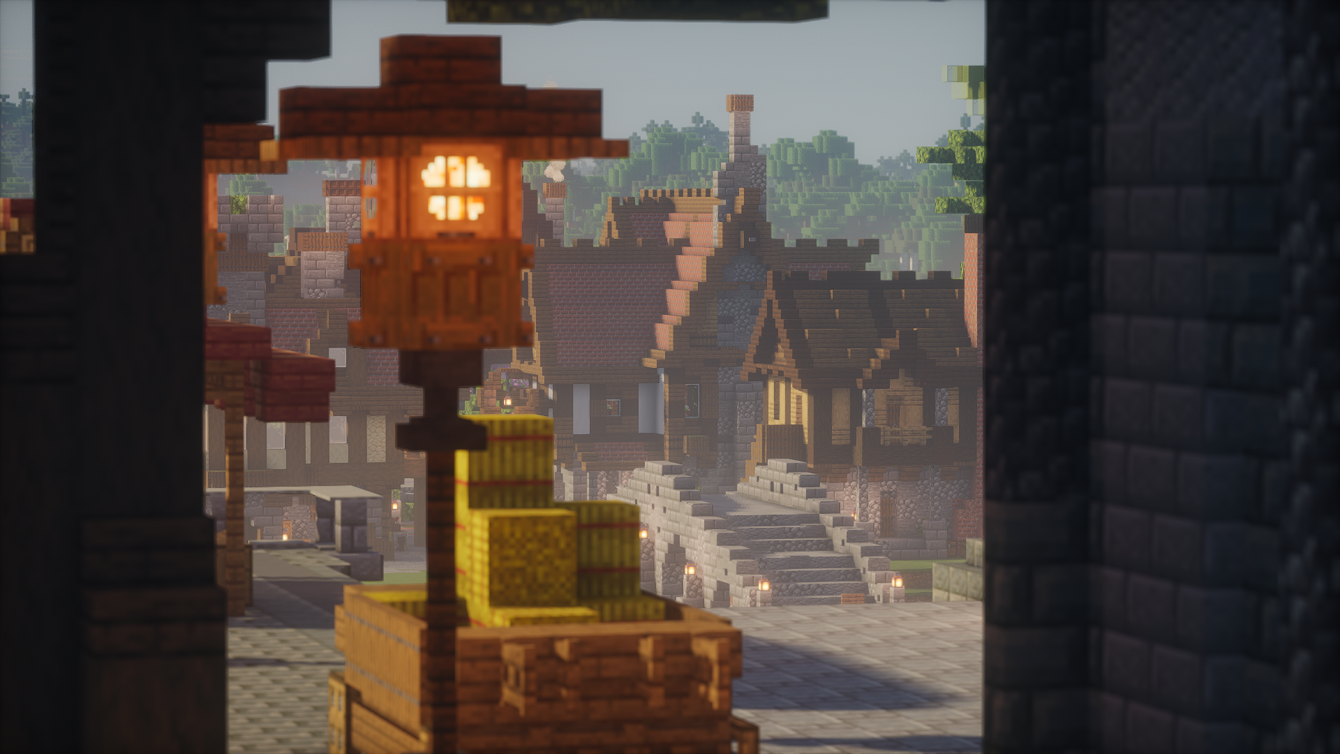 A market arch framing a lantern, hay bales, and town steps
