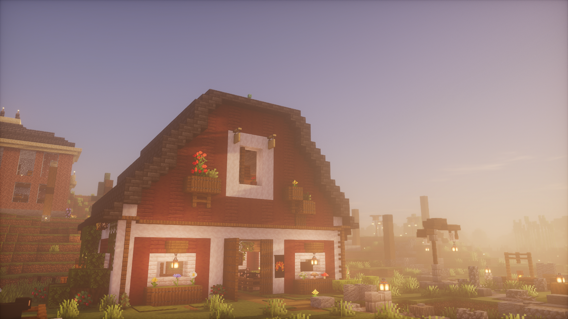 PizzaTown’s red-gabled stable surrounded by flowers and morning mist